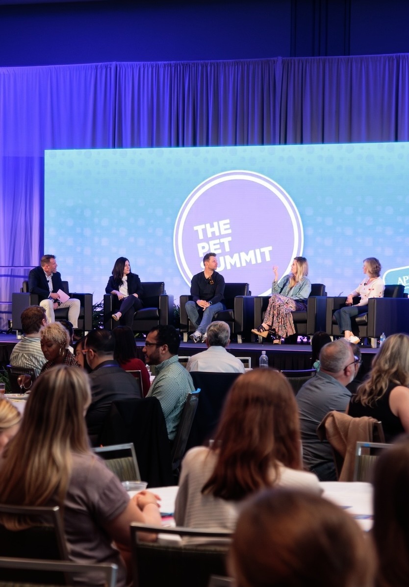 Moderator and five panelists on stage at The Pet Summit
