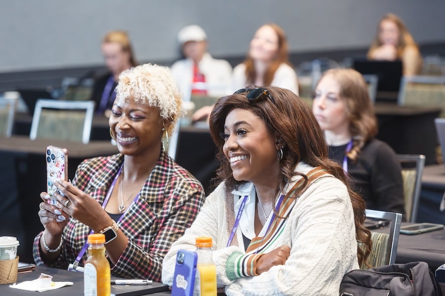 Two Women in the Audience Smiling